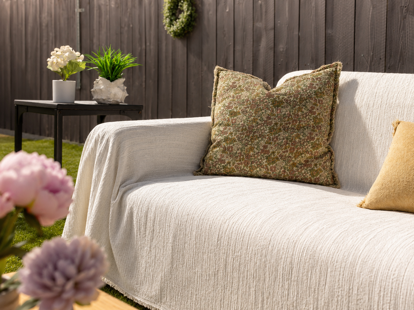 Cream White PetHallow couch cover draped over a sofa